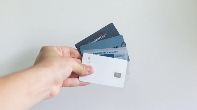An individual holding multiple credit cards