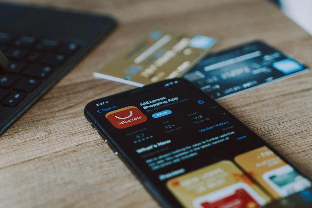 two credit cards with an iPhone