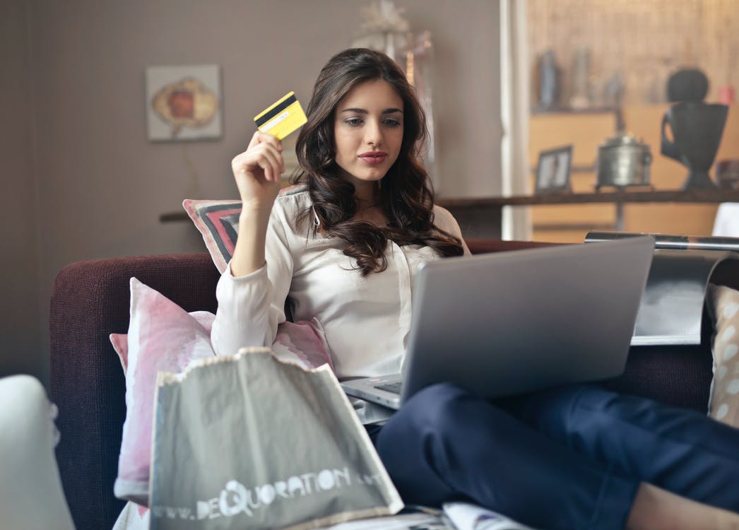A woman using a credit card for online shopping
