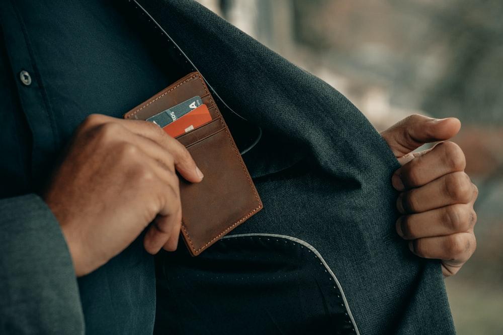 a brown credit card wallet. 