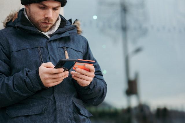 An individual using a credit card