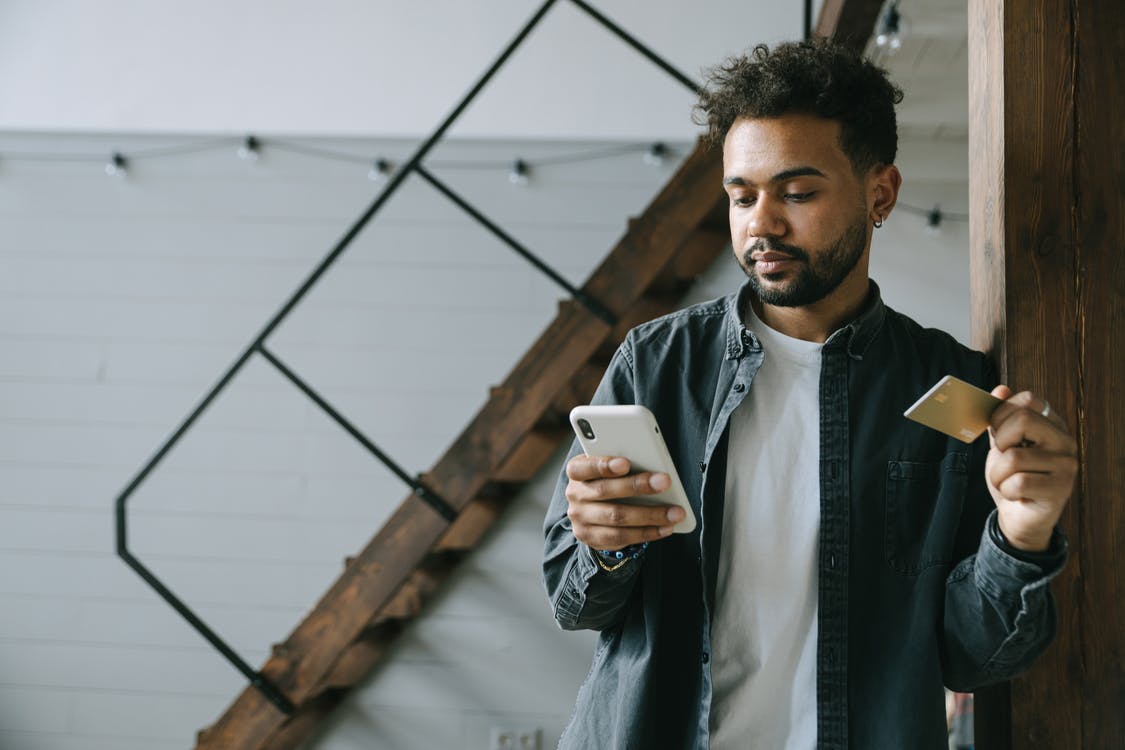 a person holding a credit card.