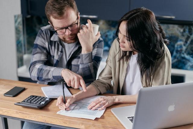 A couple making a debt repayment plan