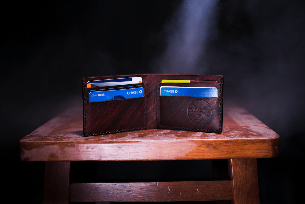 Dark brown card holder with credit cards.