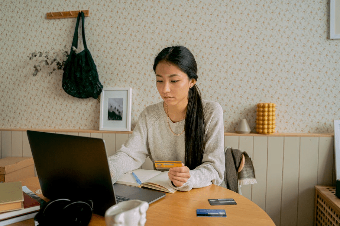 a person using a credit card to pay online