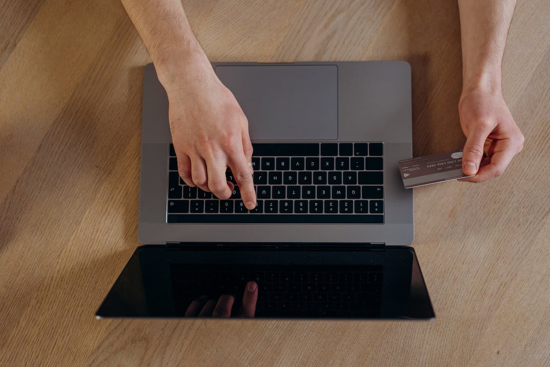 A person reading about his credit card reward program