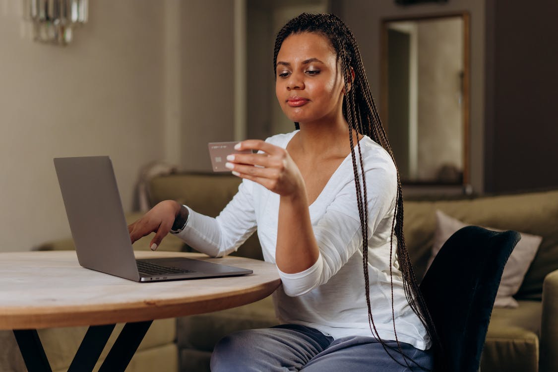 A woman using her credit card for online shopping