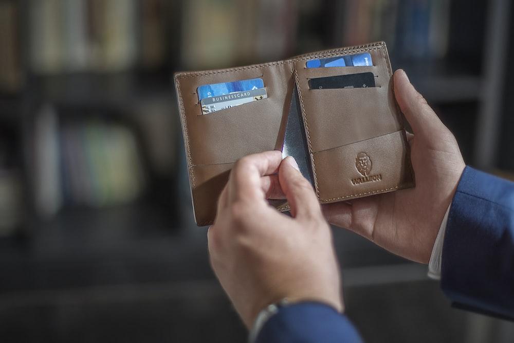 a wallet holding various credit cards