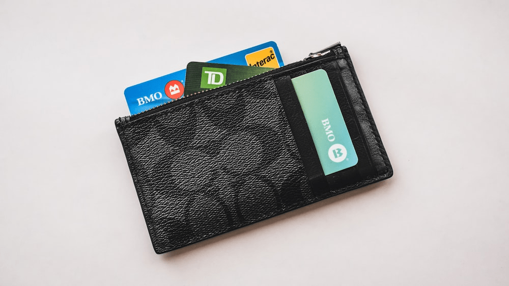Canadian credit cards in a wallet showing TD and BMO cards to illustrate managing statement date utilization in Canada
